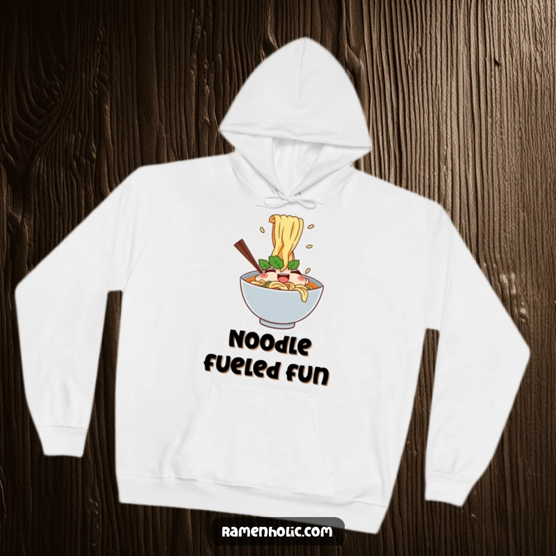 Funny hoodie featuring a happy ramen bowl character with noodles splashing, creating a warm, comforting, and humorous vibe.