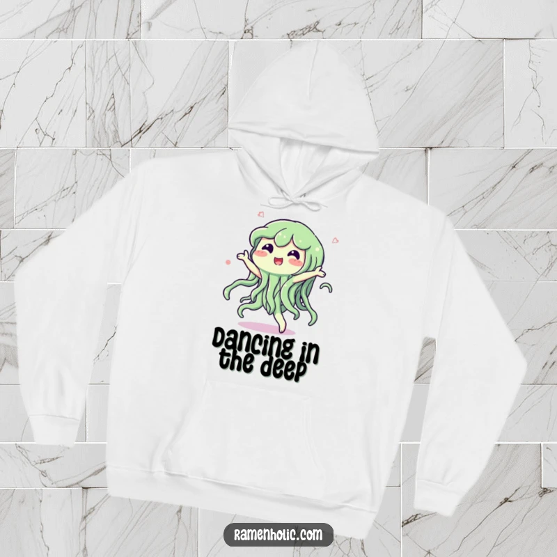 Funny hoodie featuring a happy seaweed character dancing with a swish, offering cozy comfort and underwater-themed fun.
