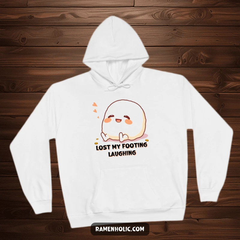 Funny Onigiri Hoodie: A cheerful onigiri character shown rolling on the floor, radiating pure mirth and coziness.